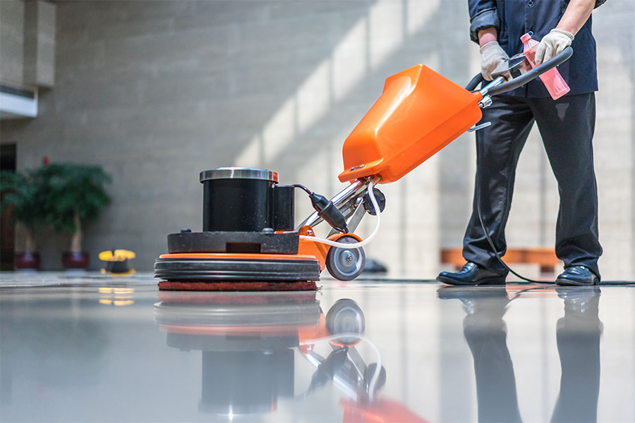 janitor waxing commercial floor