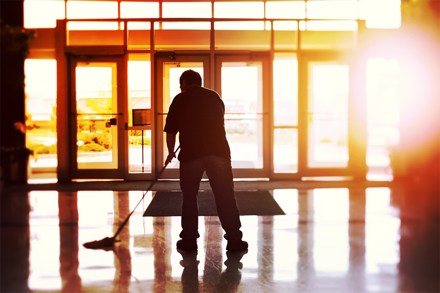 silhouette of janitor cleaning floors near front entrance garner nc